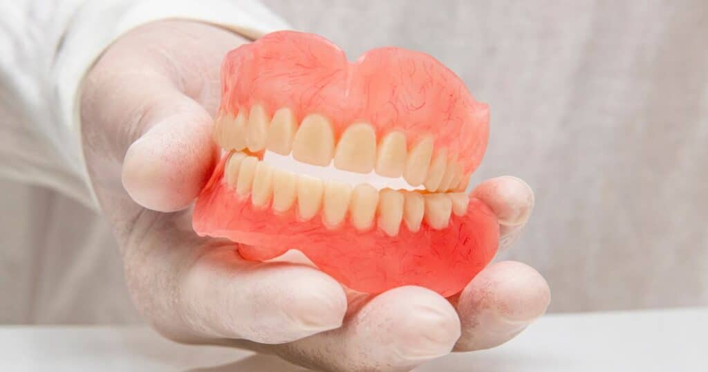 essential tips for caring for your gums and oral health while wearing dentures